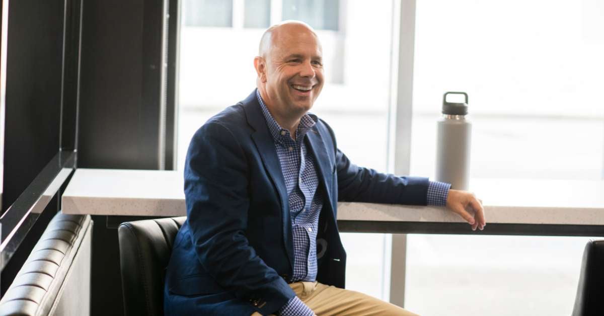 Jon Headlee sitting at table, smiling